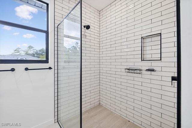 bathroom with a tile shower