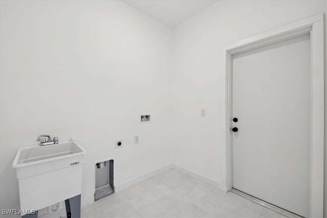 laundry area with washer hookup, hookup for an electric dryer, and sink