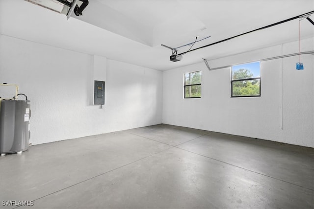 garage with electric panel, electric water heater, and a garage door opener