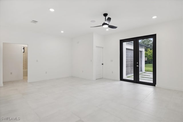 unfurnished room with ceiling fan and french doors