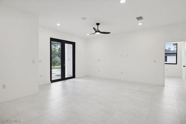 spare room with recessed lighting, french doors, visible vents, and ceiling fan