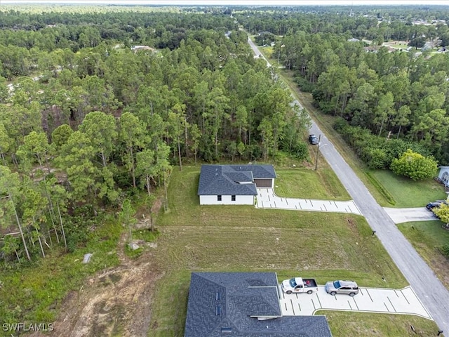 aerial view with a wooded view