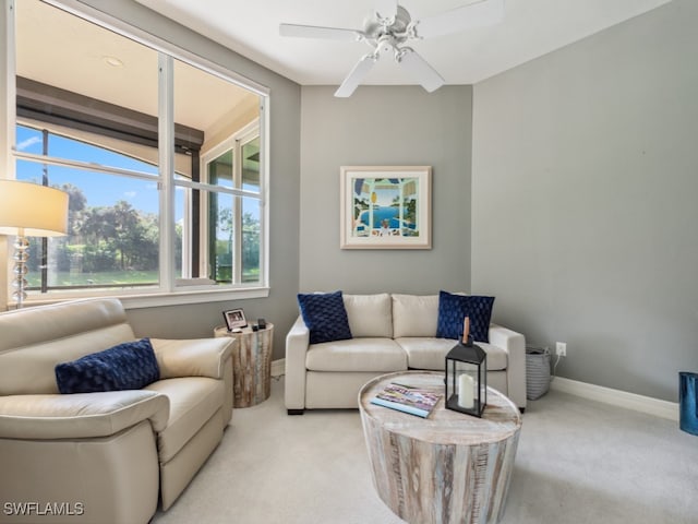 living room featuring ceiling fan and light colored carpet