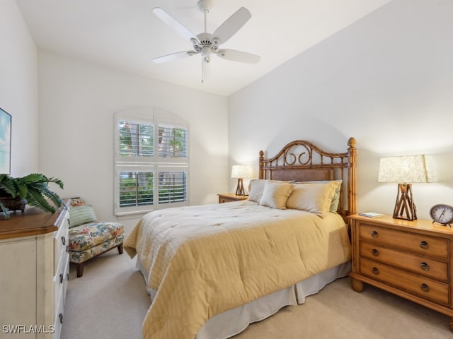 bedroom featuring ceiling fan and light colored carpet