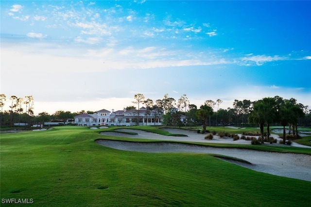 view of property's community featuring a lawn