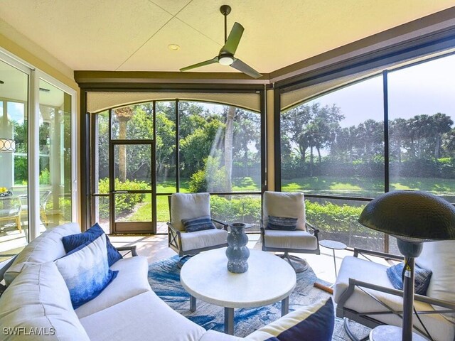 sunroom / solarium with ceiling fan and plenty of natural light