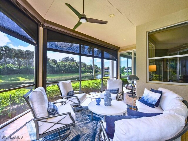 sunroom / solarium featuring ceiling fan and a wealth of natural light