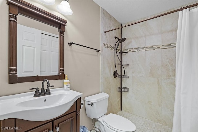 bathroom featuring a shower with curtain, vanity, and toilet