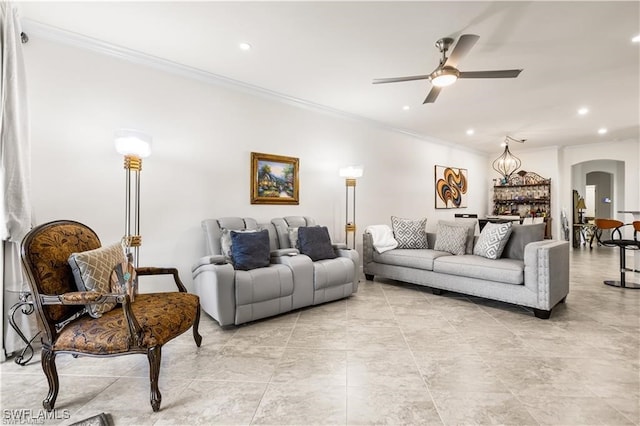 living room featuring ceiling fan and ornamental molding