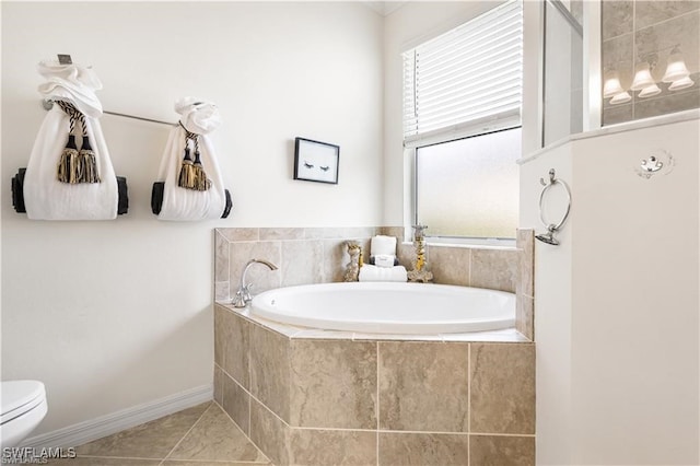 bathroom with toilet, a relaxing tiled tub, and tile patterned floors