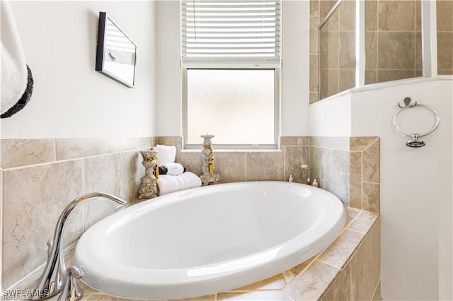 bathroom with tiled tub