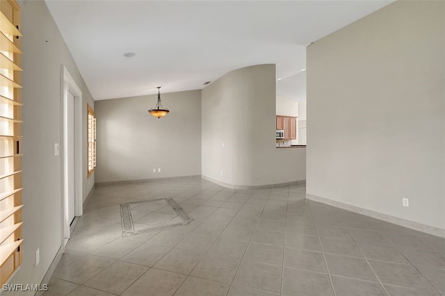 spare room with light tile patterned floors