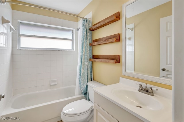 full bathroom featuring vanity, shower / bath combination with curtain, and toilet