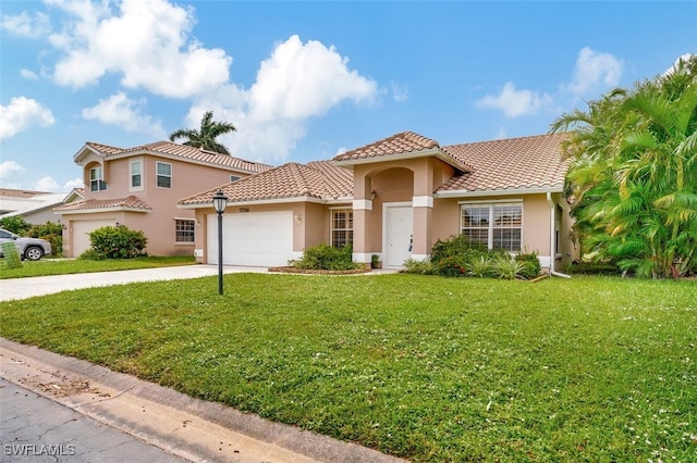 mediterranean / spanish-style house with a garage and a front lawn