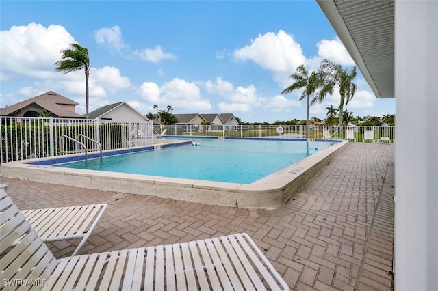 view of pool featuring a patio area