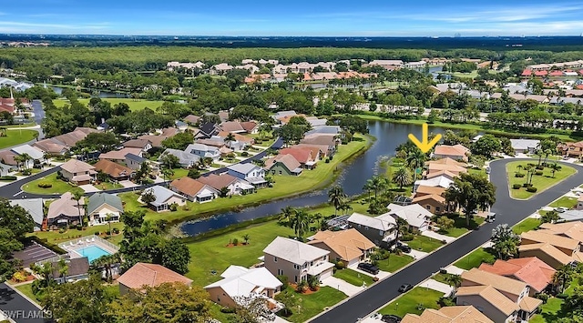 birds eye view of property featuring a water view