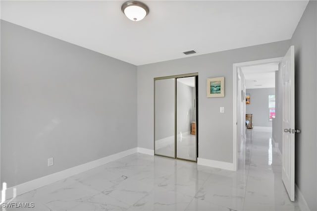 unfurnished bedroom featuring a closet