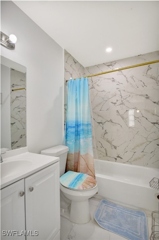 full bathroom featuring vanity, shower / bath combo with shower curtain, and toilet