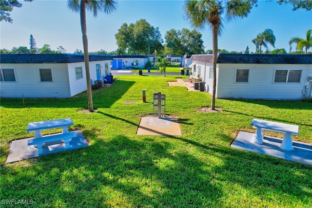 view of yard with central AC unit