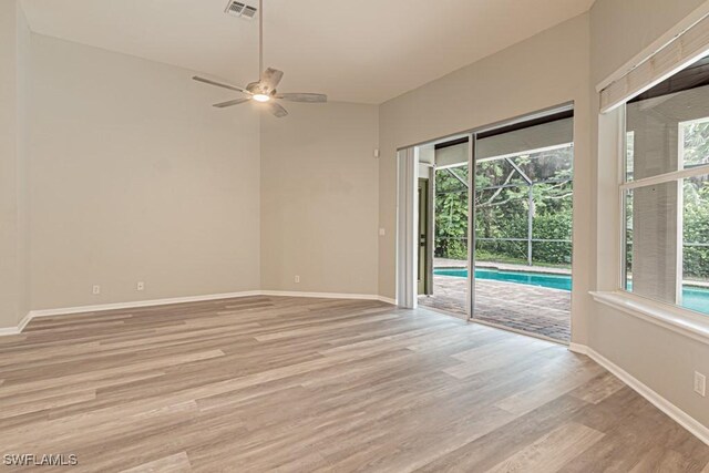 unfurnished room with ceiling fan and light hardwood / wood-style floors