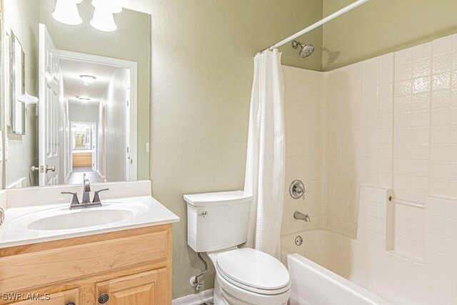 full bathroom with toilet, shower / tub combo, and vanity