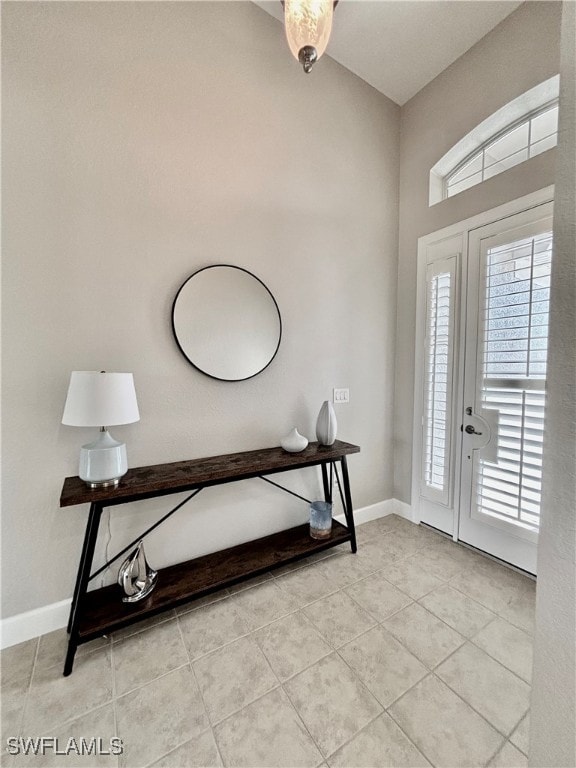 entrance foyer featuring light tile patterned flooring