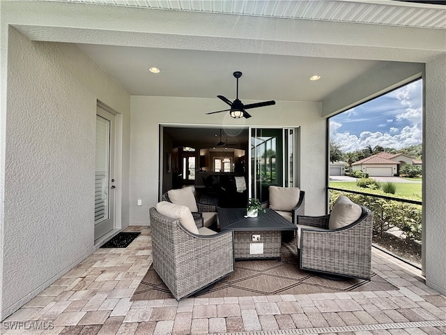 view of patio featuring outdoor lounge area and ceiling fan