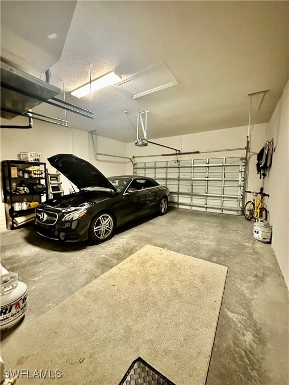 garage featuring a garage door opener