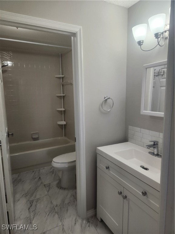 full bathroom with washtub / shower combination, vanity, toilet, and a notable chandelier