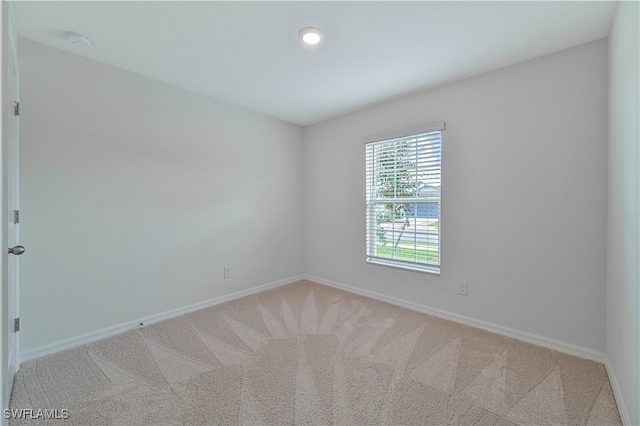 unfurnished room featuring carpet flooring