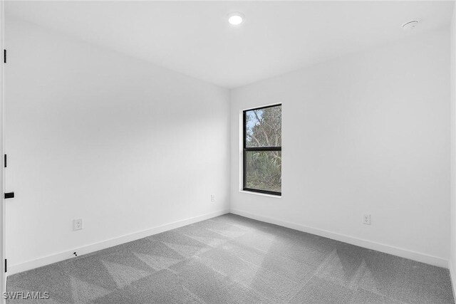 2739 NE 5th Ave, Cape Coral, FL 33909 - empty room featuring carpet, baseboards, and recessed lighting