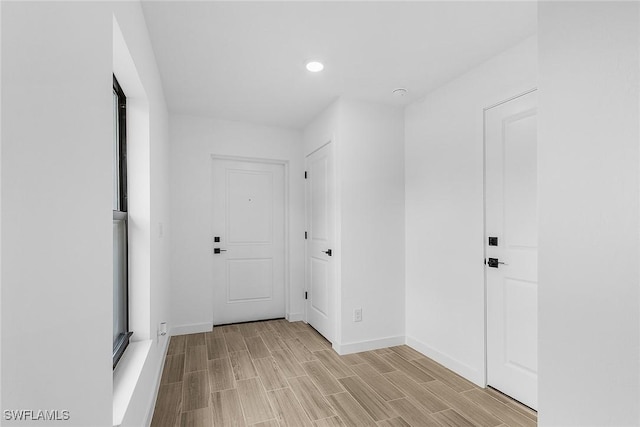 2739 NE 5th Ave, Cape Coral, FL 33909 - hallway featuring baseboards, recessed lighting, and light wood-type flooring