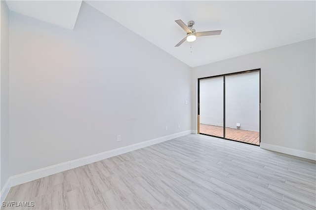 empty room with vaulted ceiling, baseboards, light wood finished floors, and ceiling fan