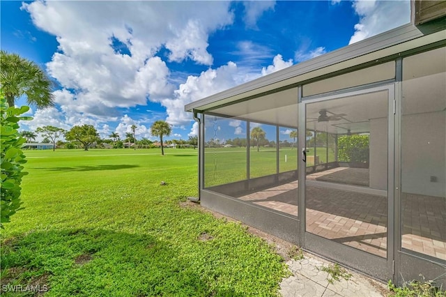 view of yard with a sunroom