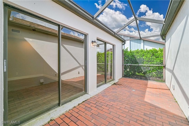 unfurnished sunroom with visible vents