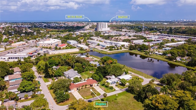 birds eye view of property with a water view