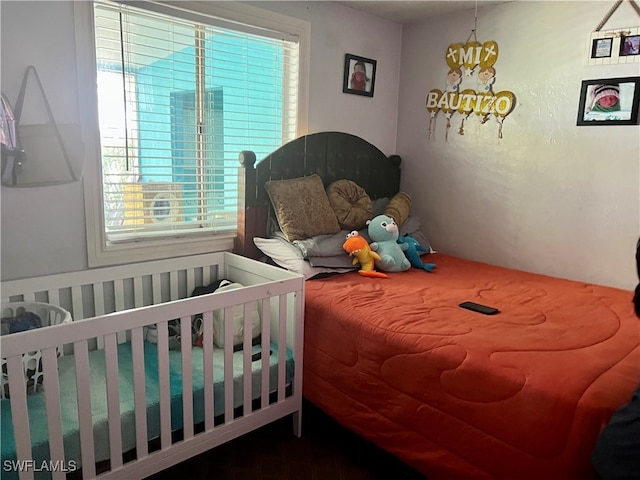 bedroom with a nursery area