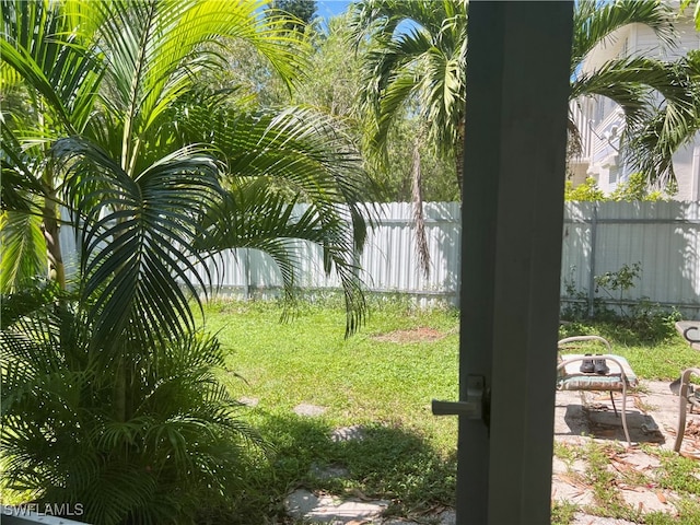 view of yard with an outdoor fire pit