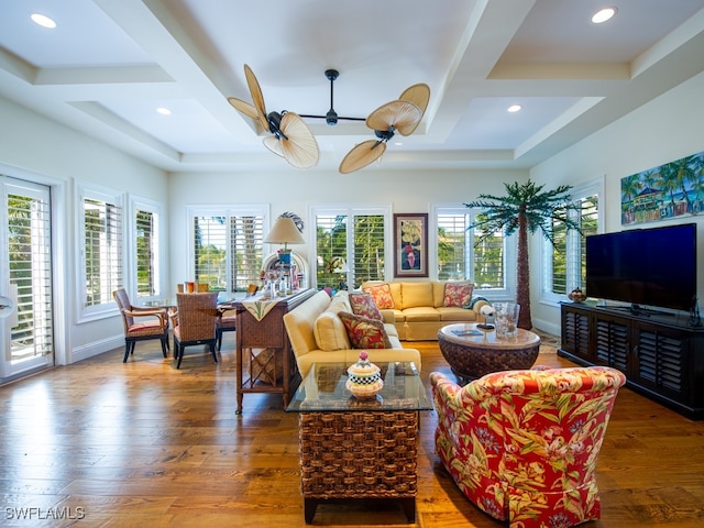 living room featuring ceiling fan, dark wood-type flooring, and coffered ceiling