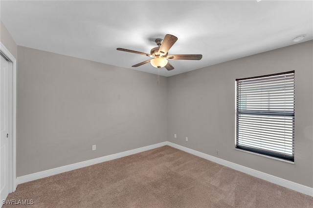 unfurnished bedroom featuring a closet, ceiling fan, and carpet