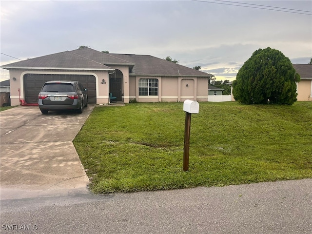 ranch-style home with a garage and a front yard