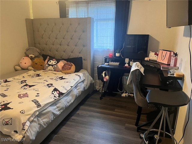 bedroom with dark wood-type flooring