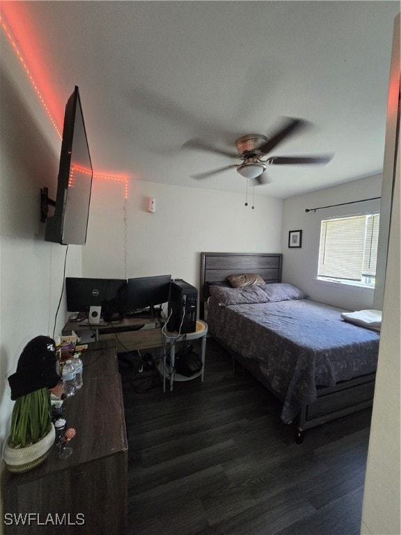 bedroom featuring ceiling fan and dark hardwood / wood-style floors