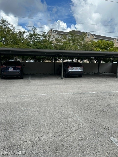 view of vehicle parking featuring a carport