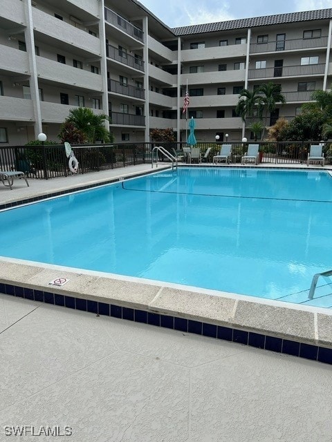 community pool featuring fence
