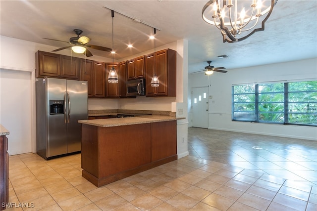 kitchen featuring hanging light fixtures, ceiling fan with notable chandelier, light stone countertops, stainless steel appliances, and kitchen peninsula