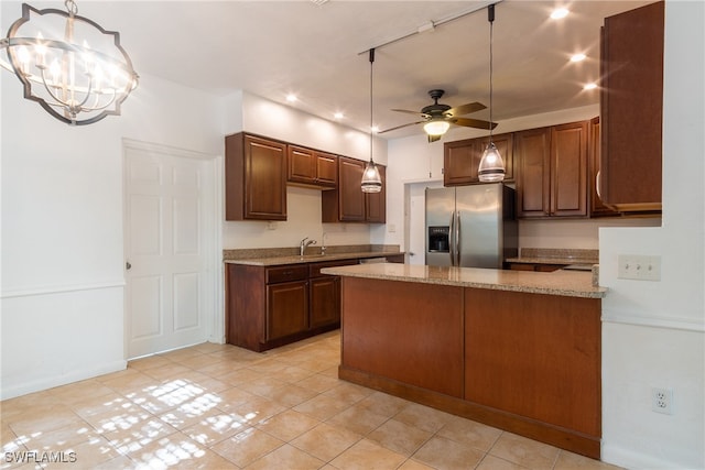 kitchen with ceiling fan with notable chandelier, light stone counters, hanging light fixtures, and stainless steel fridge with ice dispenser