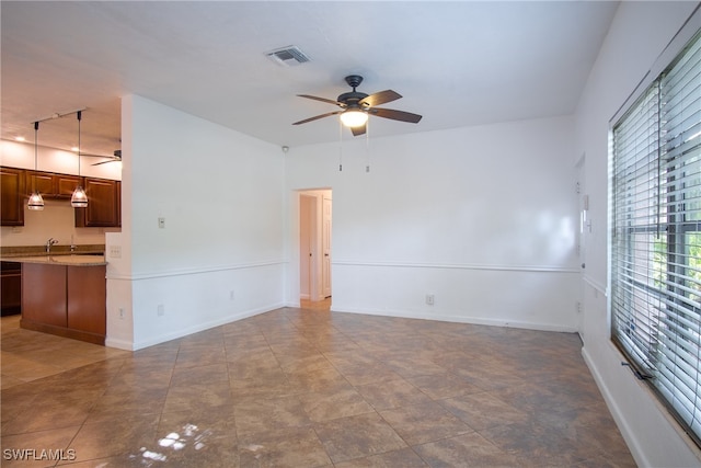 spare room with ceiling fan