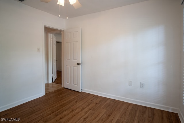 unfurnished room with ceiling fan and hardwood / wood-style flooring