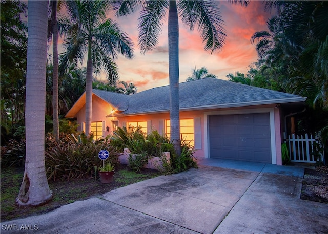 single story home with a garage